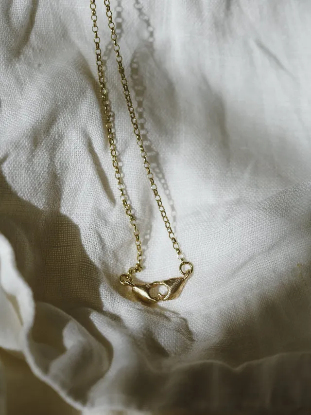 A Quiet Bond | Hand Heart Gold Necklace — Dovilė Bertulytė