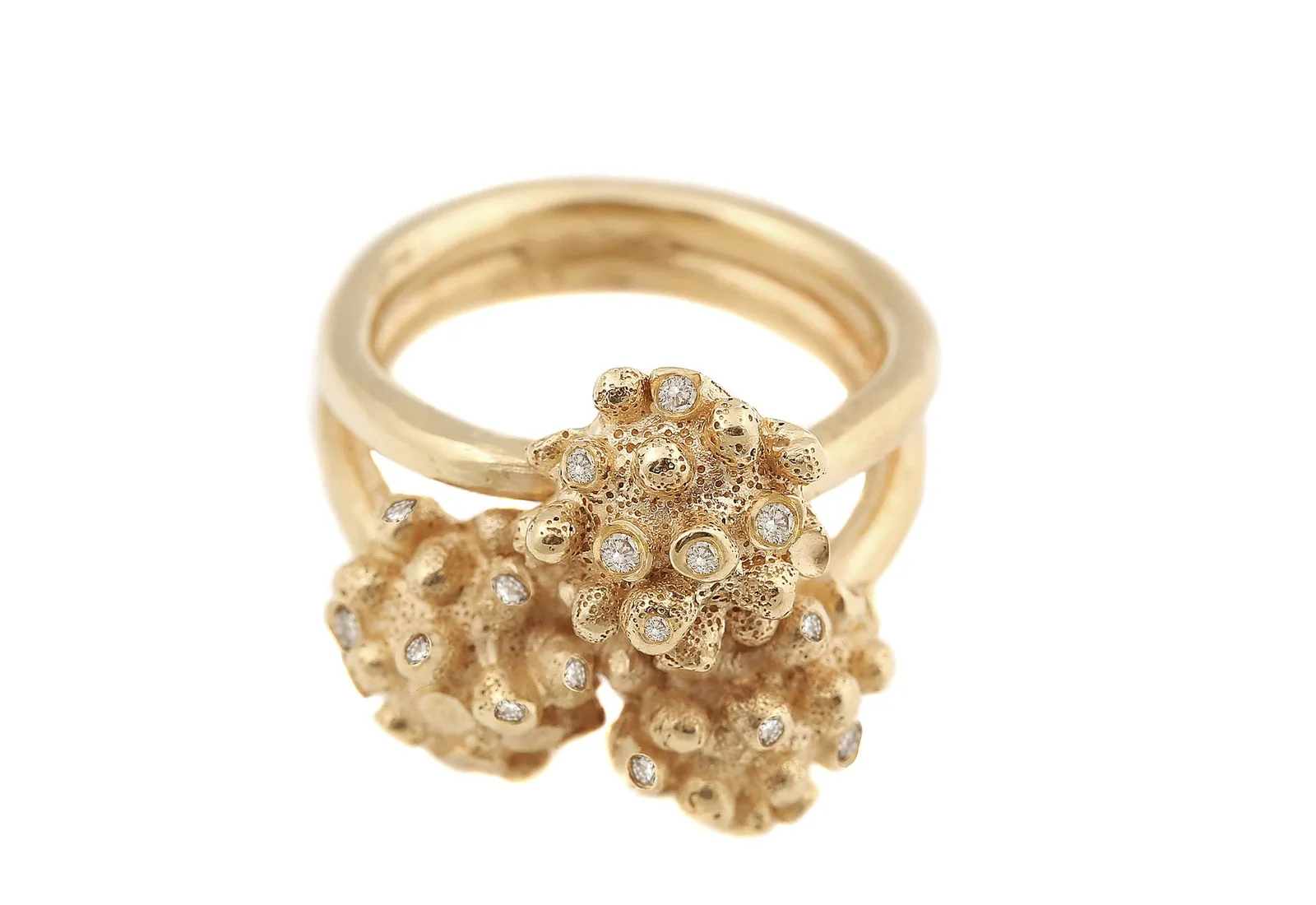 A textured gold ring with three organic, coral-like clusters set with scattered diamonds