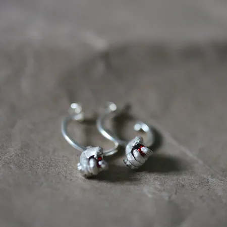 Dextera | Miniature Hand Silver Hoop Earrings With Red Garnets