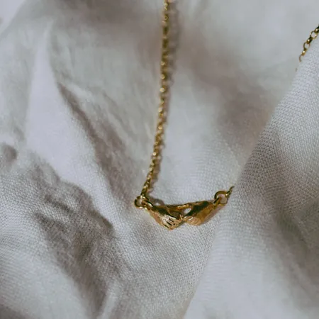 A Quiet Bond | Hand Heart Gold Necklace