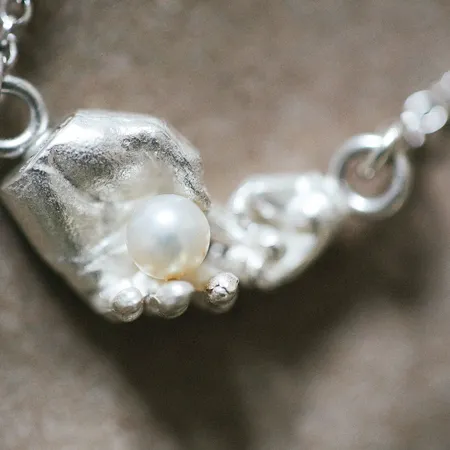 Mother & Child | White Pearl and Two Silver Hands Pendant