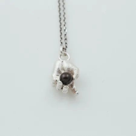 Oro | Silver Hand Holding Black Pearl Pendant